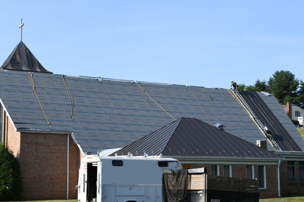 contractors installing a new roof