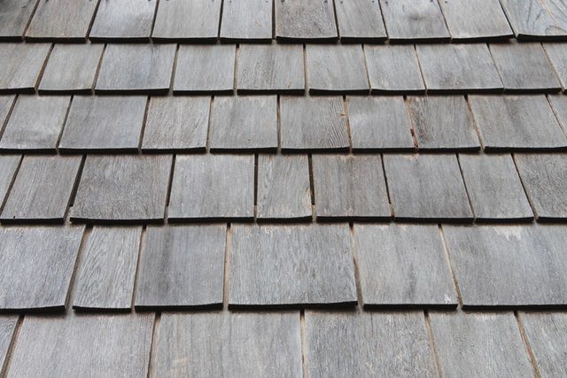 Weather faded shingles on roof top